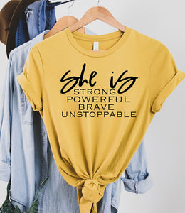 100% cotton mustard color unisex tshirt with SHE IS Strong,Powerful, Brave, Unstoppable wording.